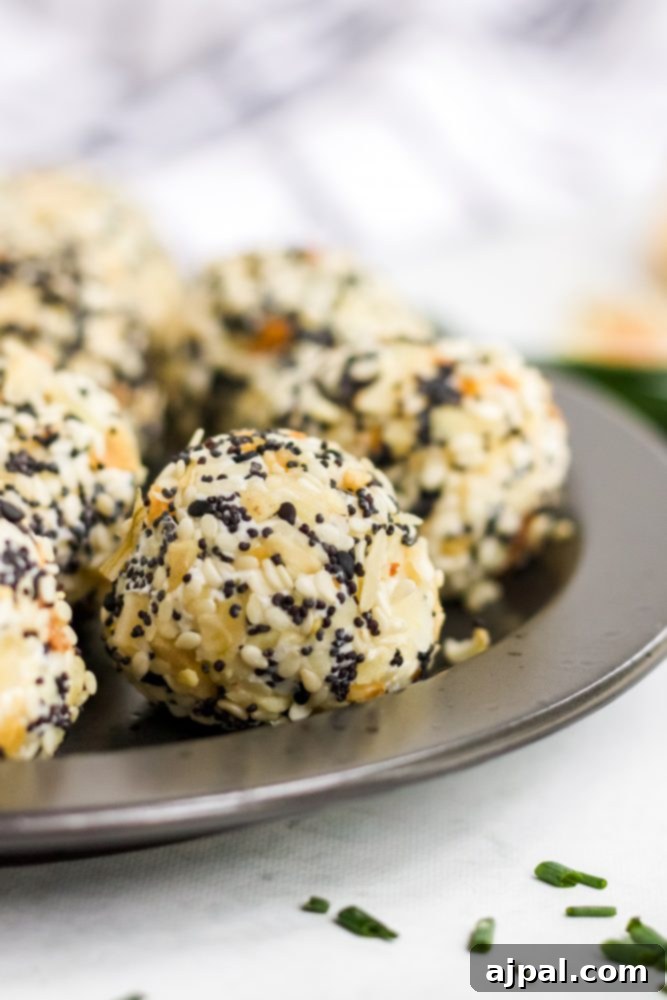 Savory Keto Everything Bagel Fat Bomb 3 picture of fat bombs in everything bagel seasoning on a plate