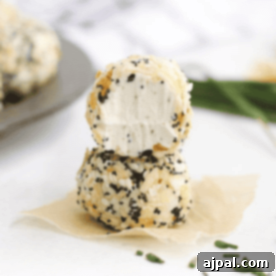 Savory Keto Everything Bagel Fat Bomb 15 Two cheese balls stacked on top of each other resembling an everything bagel fat bomb.