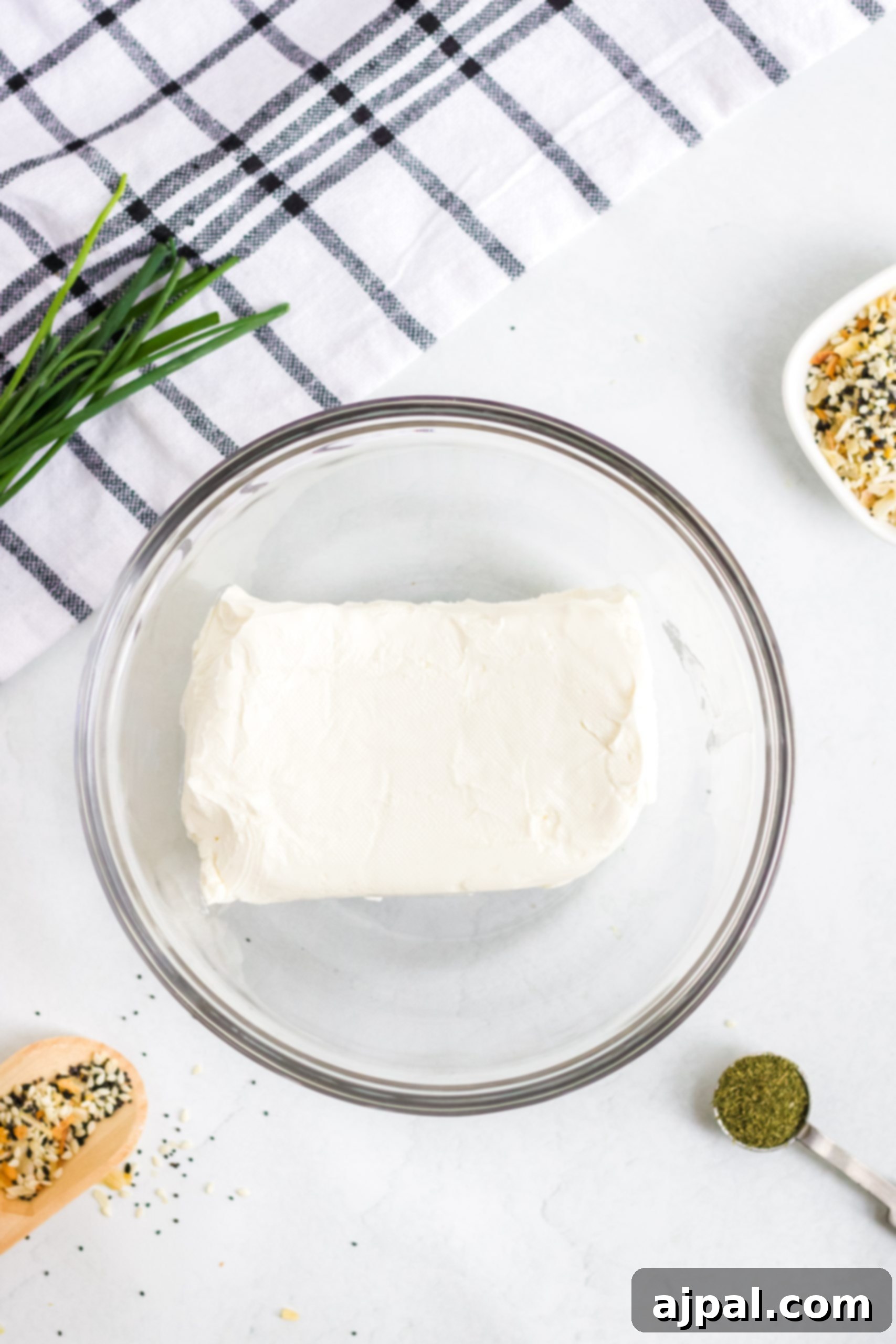 Savory Keto Everything Bagel Fat Bomb 4 A keto fat bomb featuring cream cheese and herbs/spices on a white background.