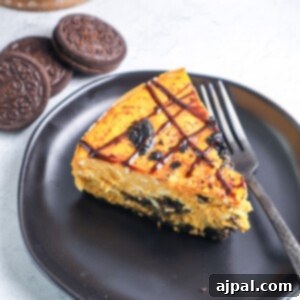 Instant Pot Pumpkin Oreo Dream Cheesecake 8 Instant Pot Pumpkin Oreo Cheesecake recipe on a plate with a fork.