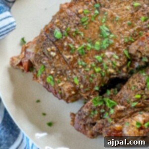 A picture of Dr Pepper pot roast on a white plate, ready to be served.