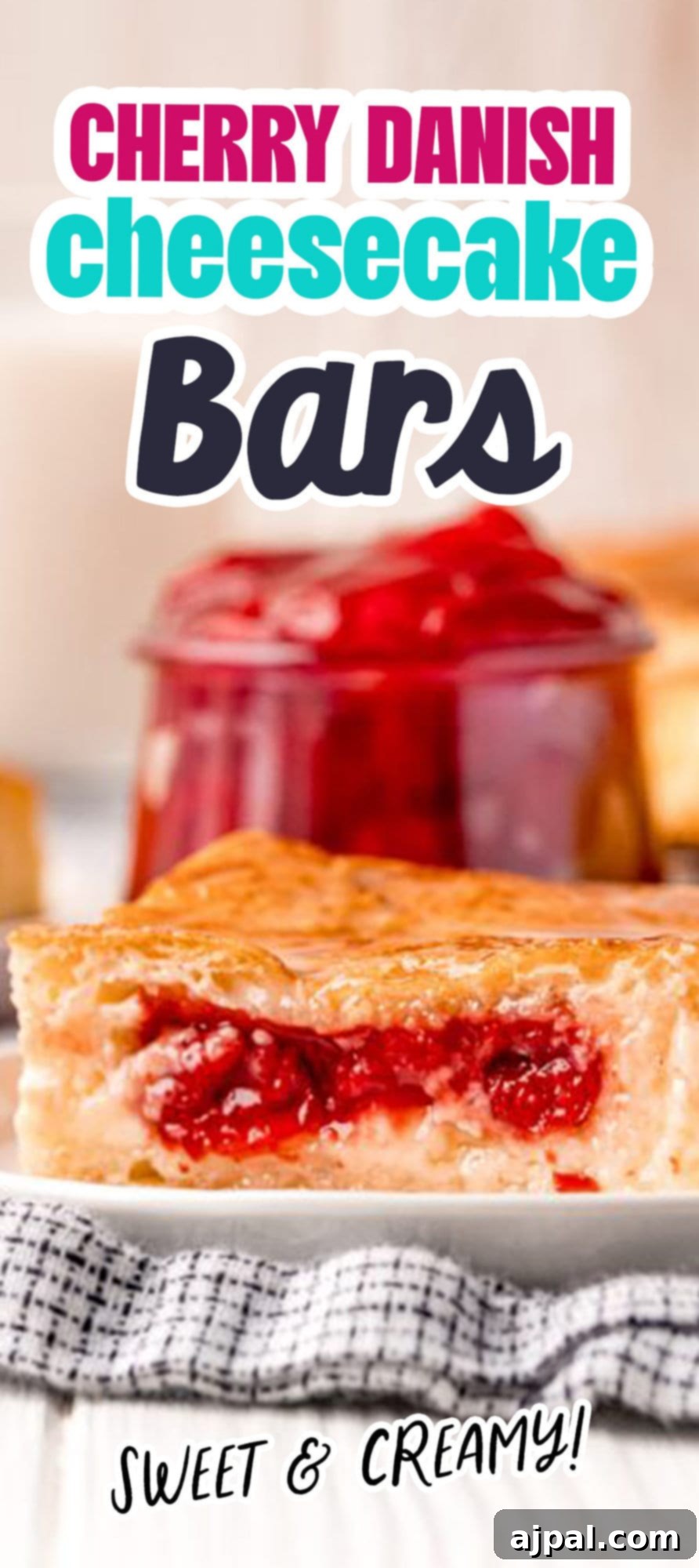 Baked cherry cheesecake danish on a white plate