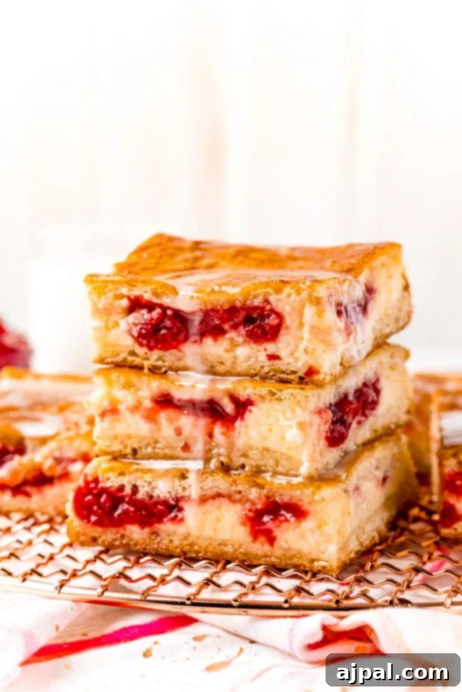 baked cherry cheesecake danish on a white plate