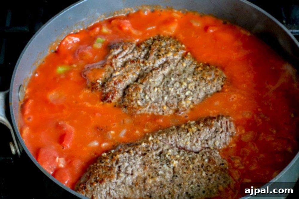 Homemade Swiss Steak: A Step-by-Step Guide 6 cube steak in tomato sauce
