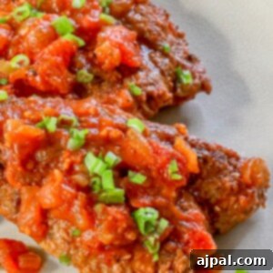 Homemade Swiss Steak: A Step-by-Step Guide 8 A plate of chicken breasts with tomato sauce.