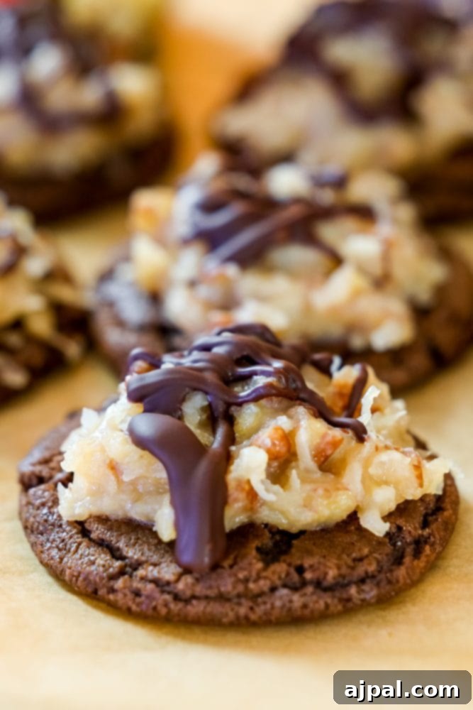 Coconut Pecan German Chocolate Cookies 2 Delicious German Chocolate Cookies featuring a chocolate base, topped with a rich coconut-pecan frosting and a delicate chocolate drizzle.