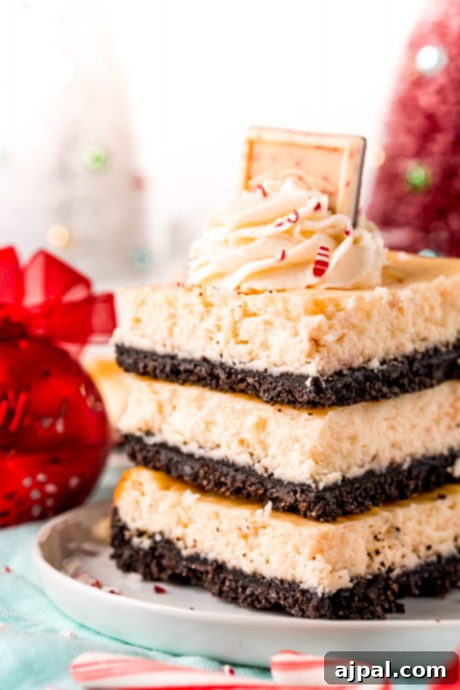 A neat stack of prepared Peppermint Cheesecake Bars, perfect for holiday gatherings.