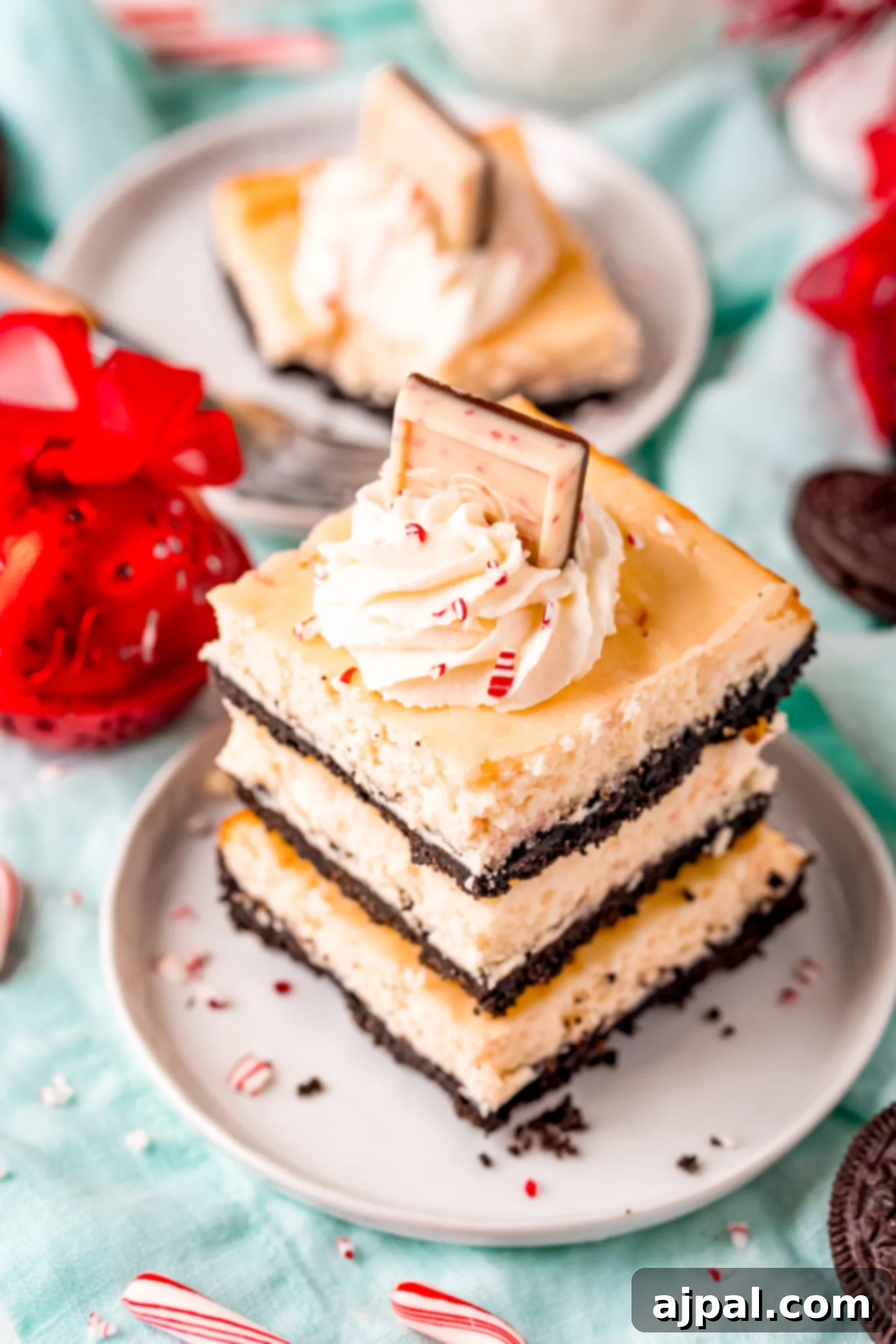 A plate of peppermint cheesecake bars, perfectly sliced and ready to serve.