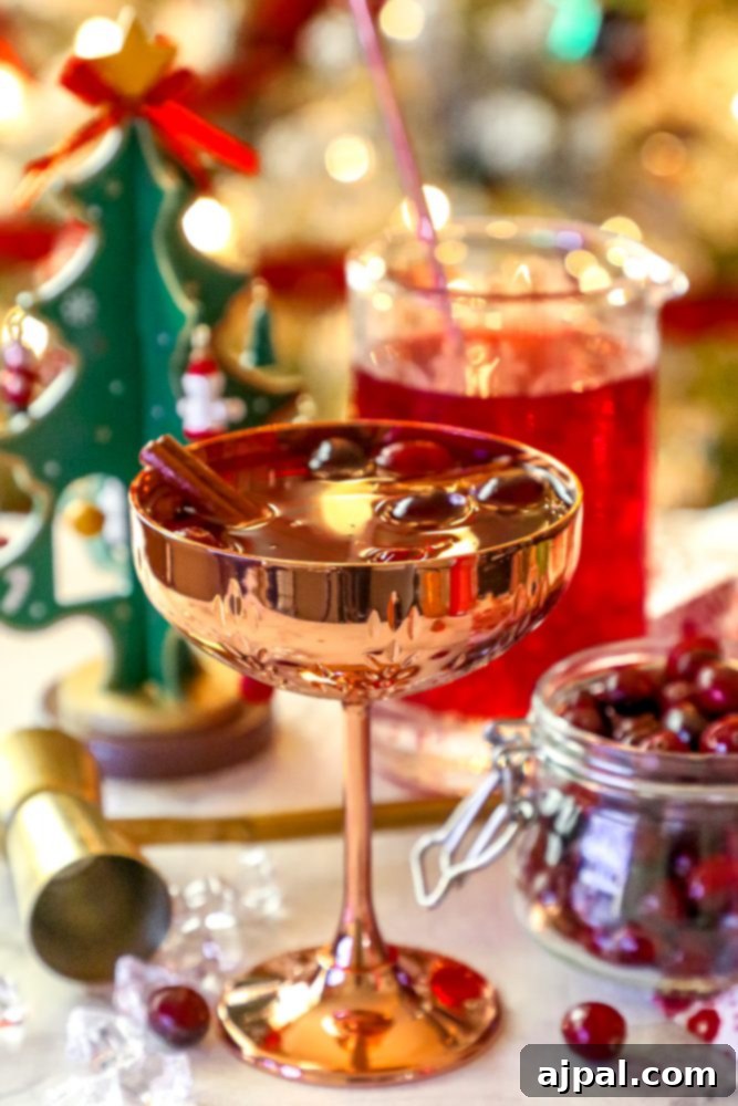 An easy Christmas cranberry cocktail with ice cubes.