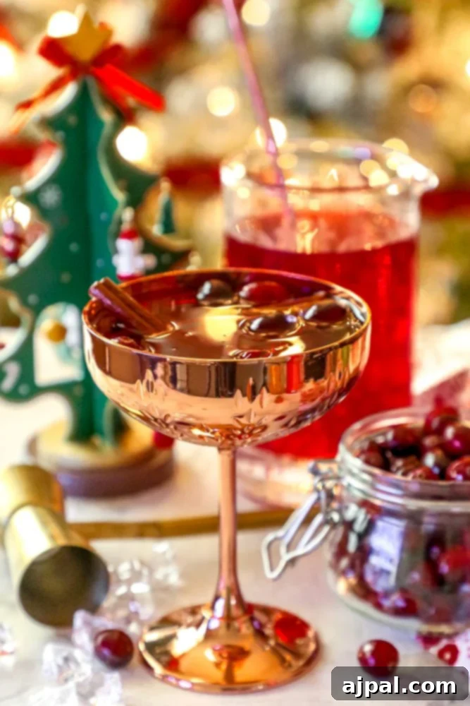 An easy Christmas cranberry cocktail with ice cubes.