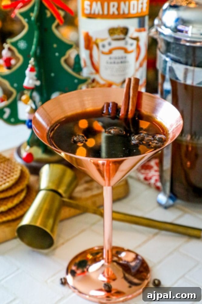 A sophisticated brass martini glass, generously filled with coffee beans and adorned with cinnamon sticks, serves as an elegant backdrop, hinting at the rich flavors of a classic espresso martini.