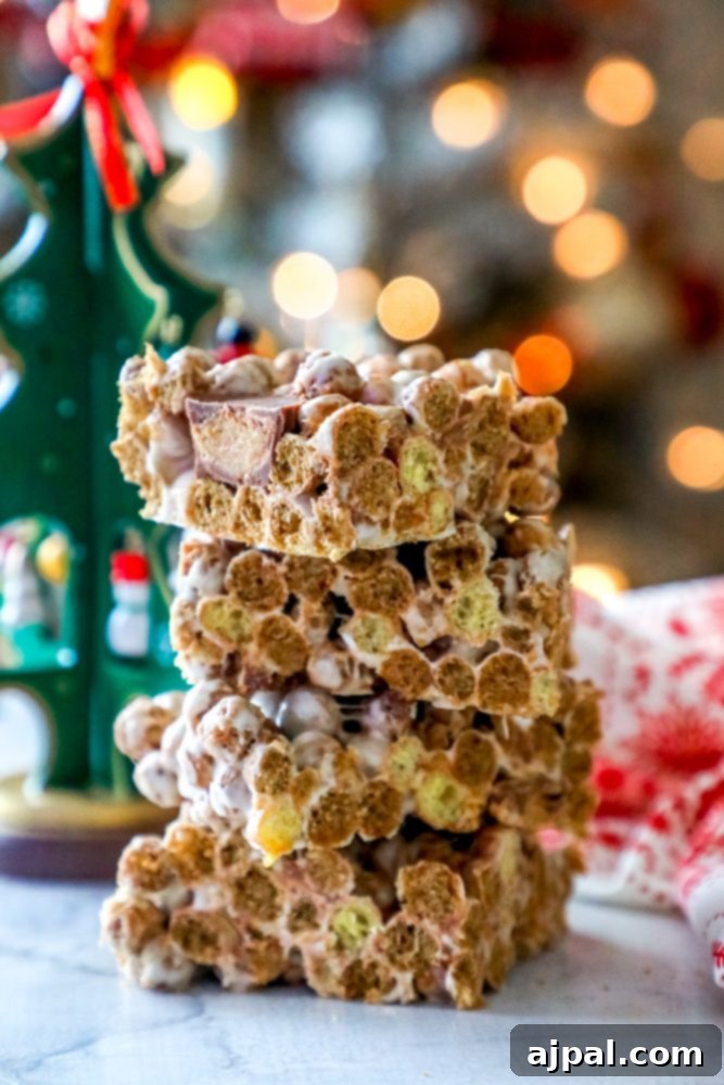 Reese's Peanut Butter Cereal Treats 2 Graham cracker bars with a Christmas tree in the background, perfect for making Reeses treats.