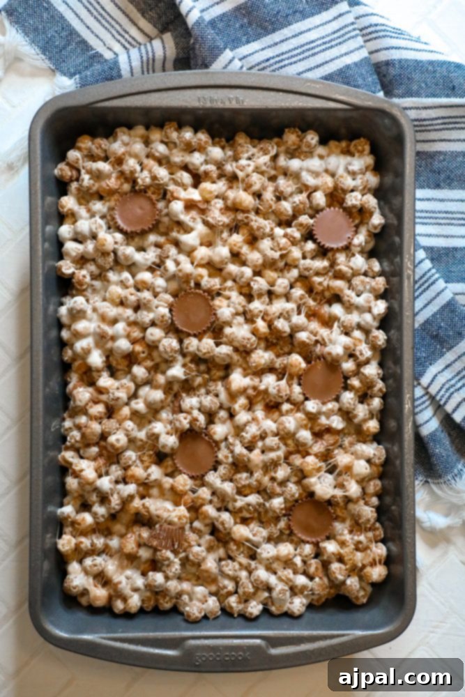 Reese's Peanut Butter Cereal Treats 6 A baking pan full of no-bake Reeses Puffs treats.