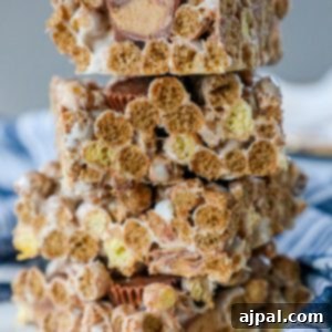 Reese's Peanut Butter Cereal Treats 7 A stack of Reeses cereal treats stacked on top of each other.