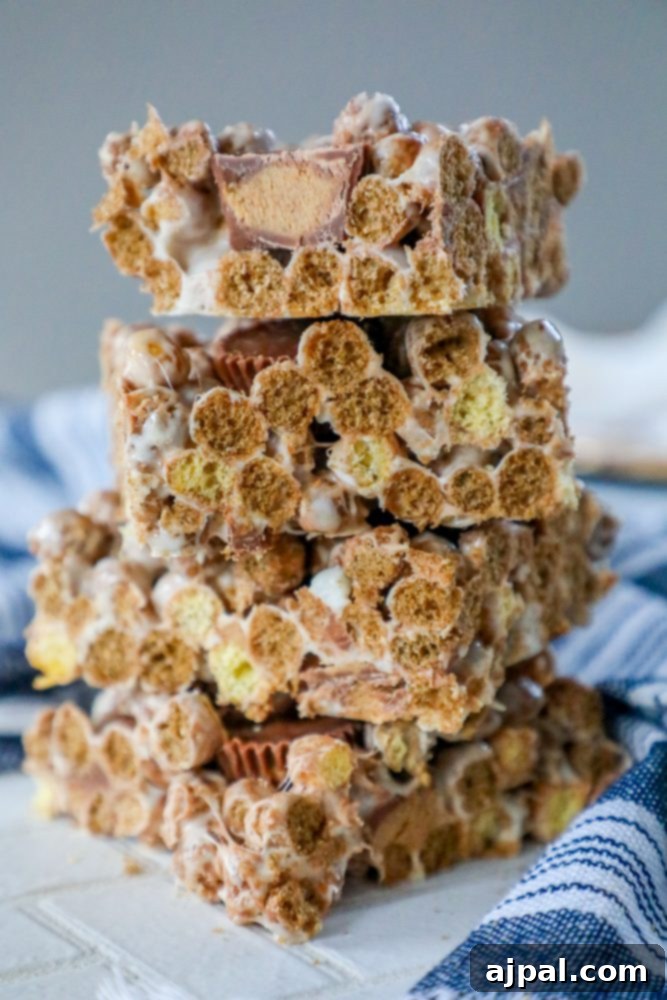 Reese's Peanut Butter Cereal Treats 5 A stack of Reeses cereal treats stacked on top of each other.