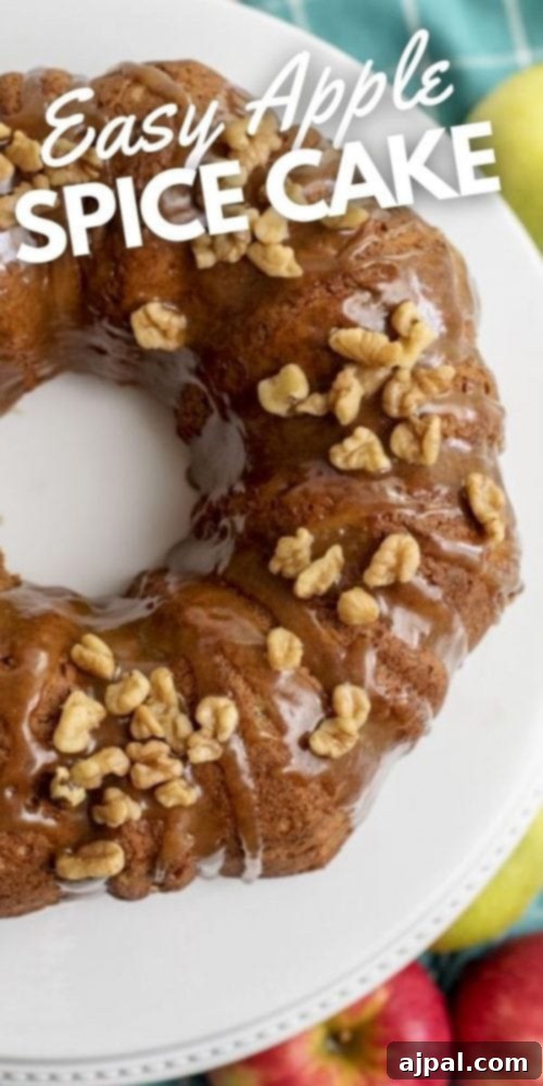 Decadent Caramel Apple Spice Cake Made Easy 13 A stunning, tall bundt cake, richly spiced and generously glazed with caramel, ready for slicing. The perfect easy apple spice cake recipe.