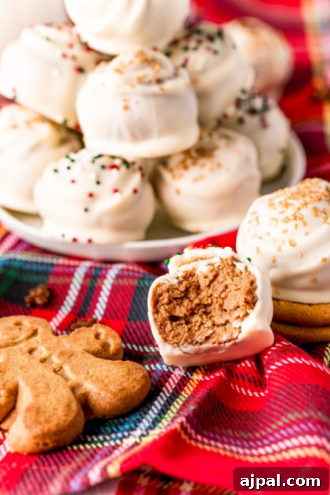 Picture of gingerbread round cookie bites with sprinkles stacked on a plate, one with a bite taken out of it. These delicious truffles are perfect for holiday celebrations.