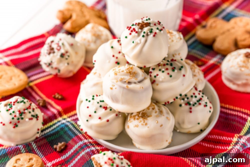 A plate of gingerbread truffles and a glass of milk on a plaid tablecloth, evoking cozy holiday vibes.