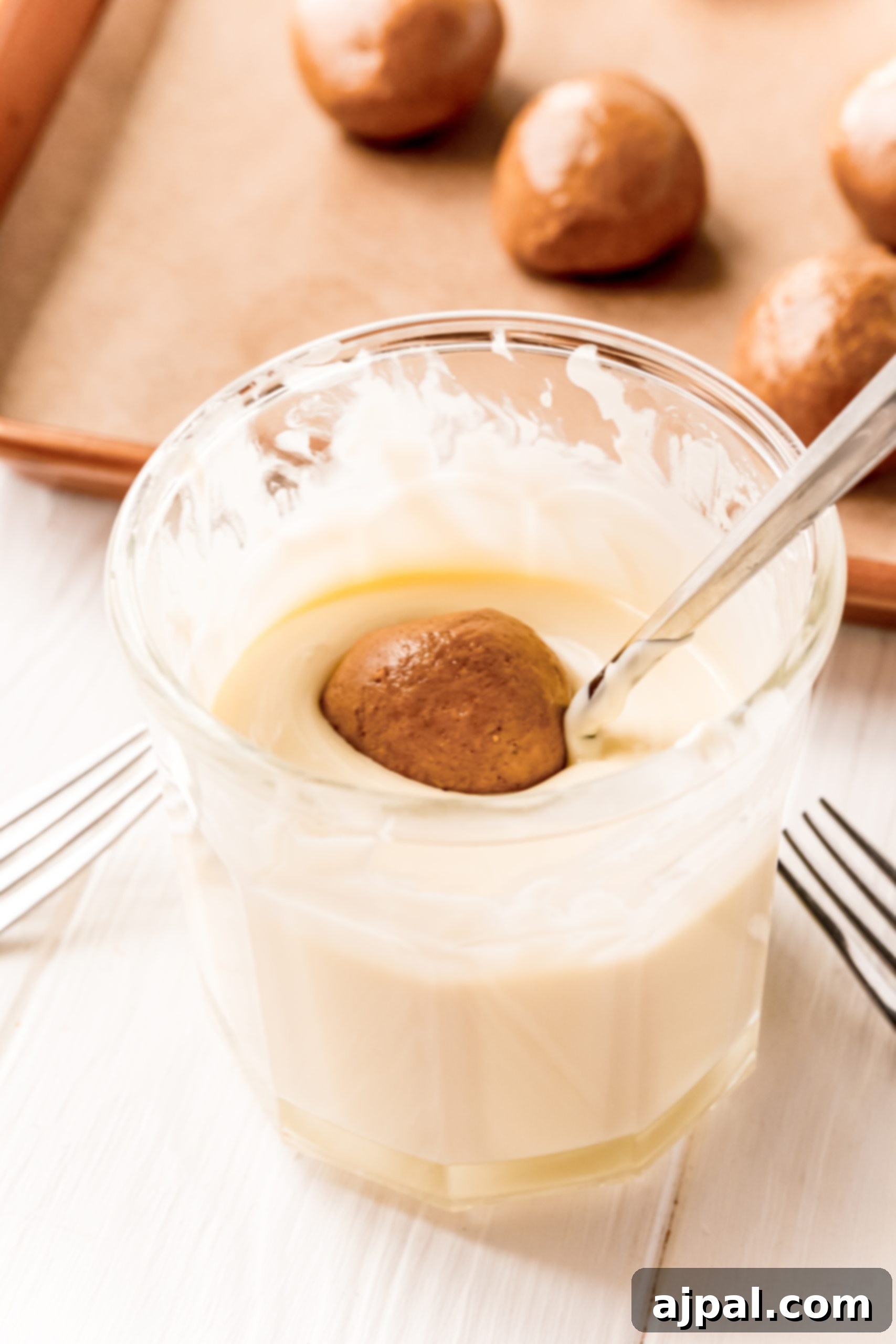 A bowl of gingerbread truffles alongside a bowl of doughnuts, perfect for a holiday dessert spread.