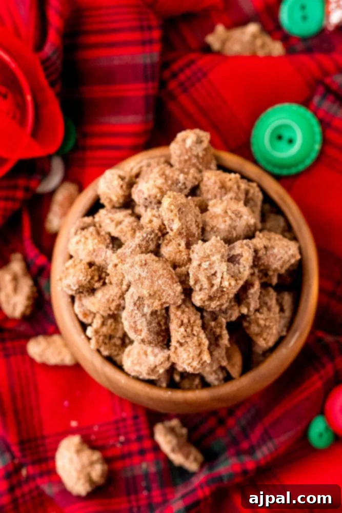 A bowl of easy candied almonds on a red tartan cloth.