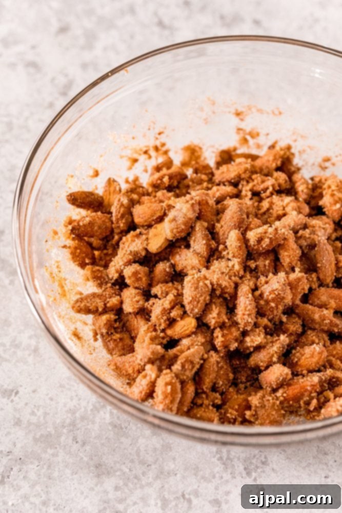 Picture of almonds and egg whites in sugar in a bowl