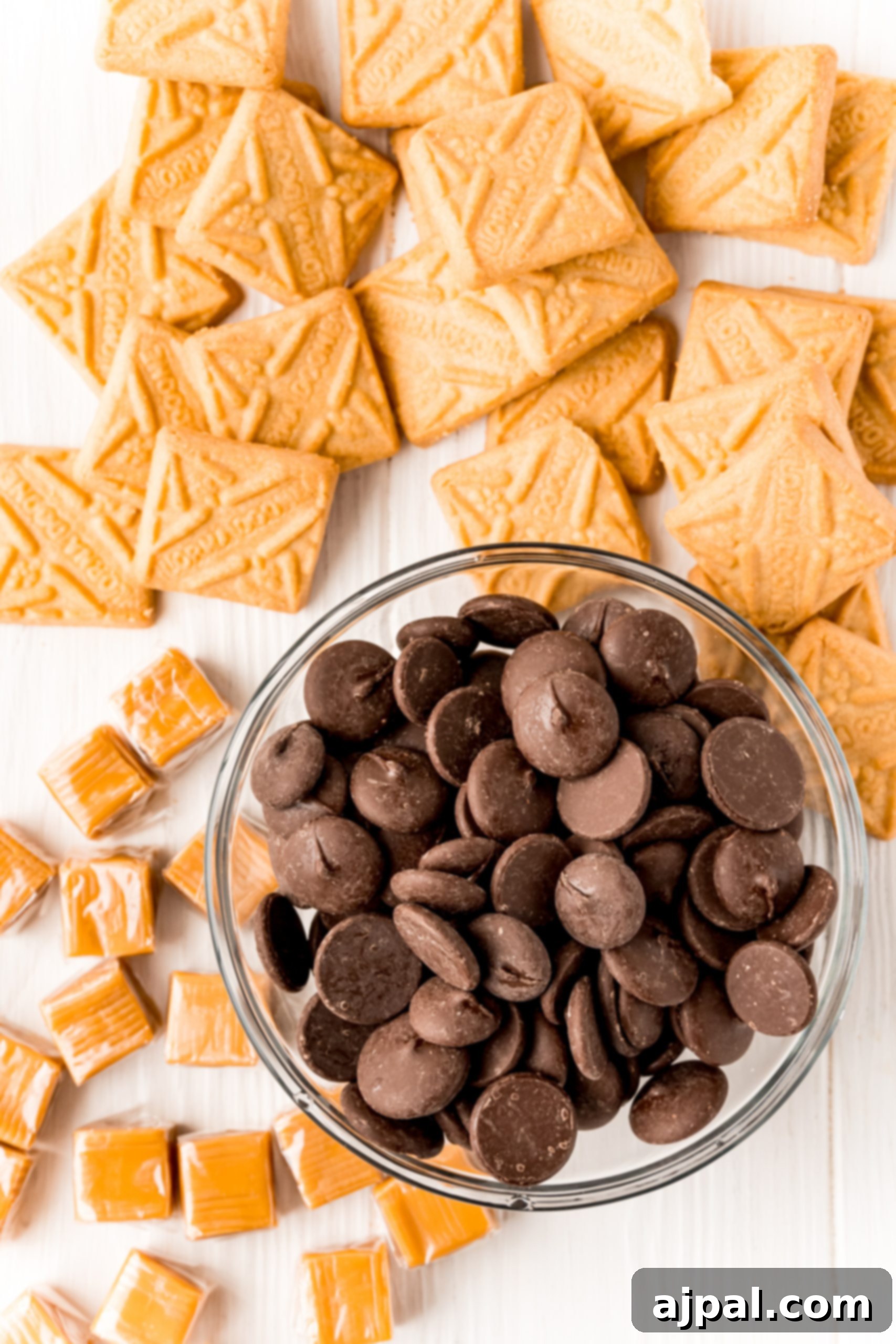 Decadent Millionaire Shortbread Bites Made Easy 8 A bowl of chocolate chips and crisp shortbread crackers, essential ingredients for crafting delicious Easy Millionaire Shortbread Bites or Shortcut Millionaire Bars.