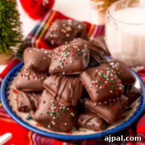 Decadent Millionaire Shortbread Bites Made Easy 17 Delicious chocolate covered marshmallows served alongside a glass of milk.