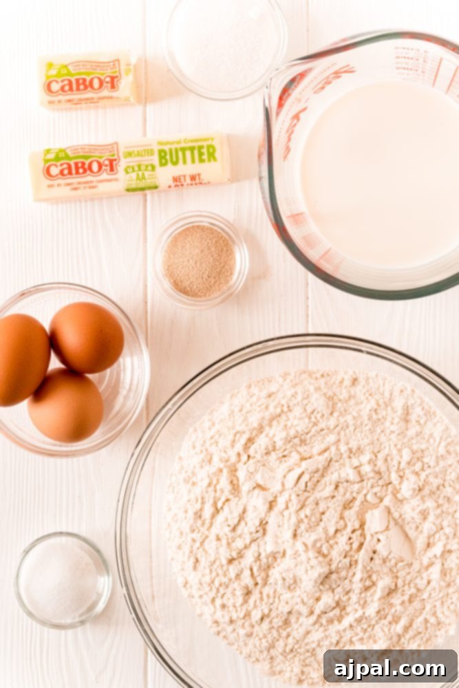 Effortless Melt-in-Your-Mouth Buttery Dinner Rolls 7 yeast, butter, flour, eggs, salt on a table