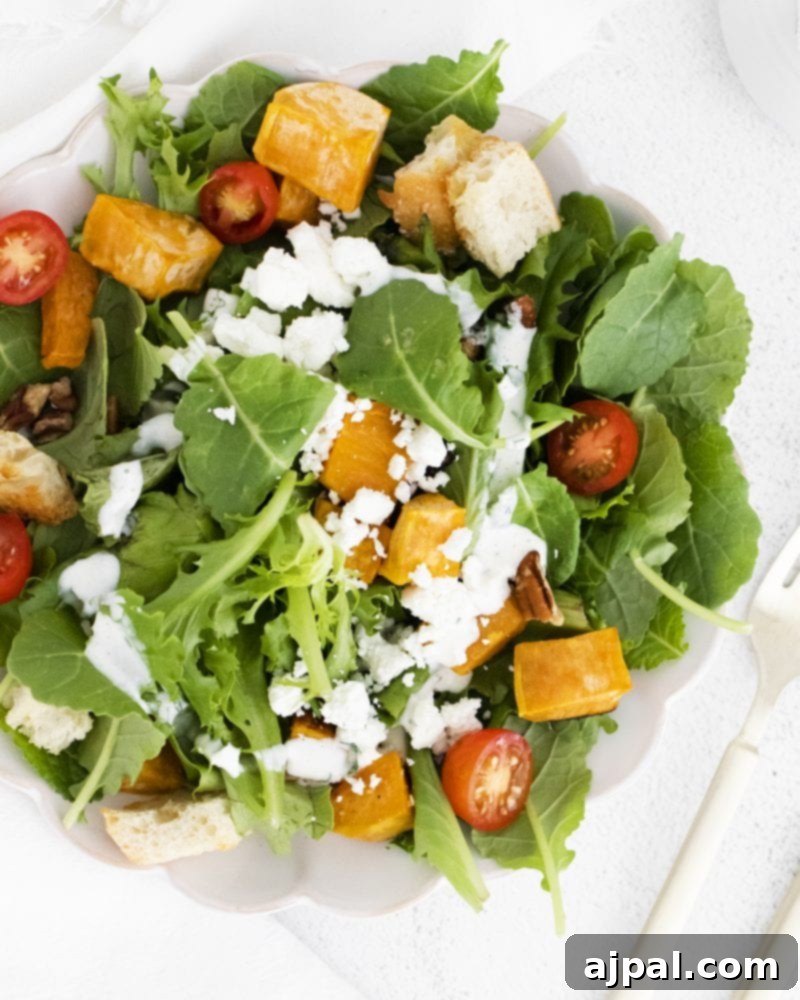 Roasted Sweet Potato Salad with Tangy Goat Cheese 6 A vibrant bowl of arugula salad featuring creamy goat cheese, crunchy walnuts, and savory roasted sweet potatoes.
