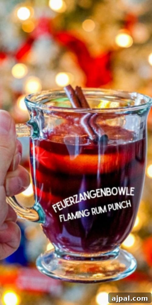 A vibrant and festive image of flaming rum punch, showcasing the fiery spectacle of Feuerzangenbowle, perfect for holiday entertaining.