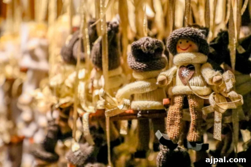 Decorative wooden dolls hanging from string at a Christmas market.