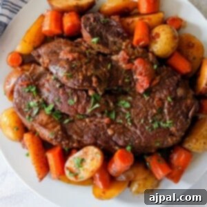 Effortless Pot Roast in Your Instant Pot 9 picture of pot roast and vegetables on a plate in front of an instant pot