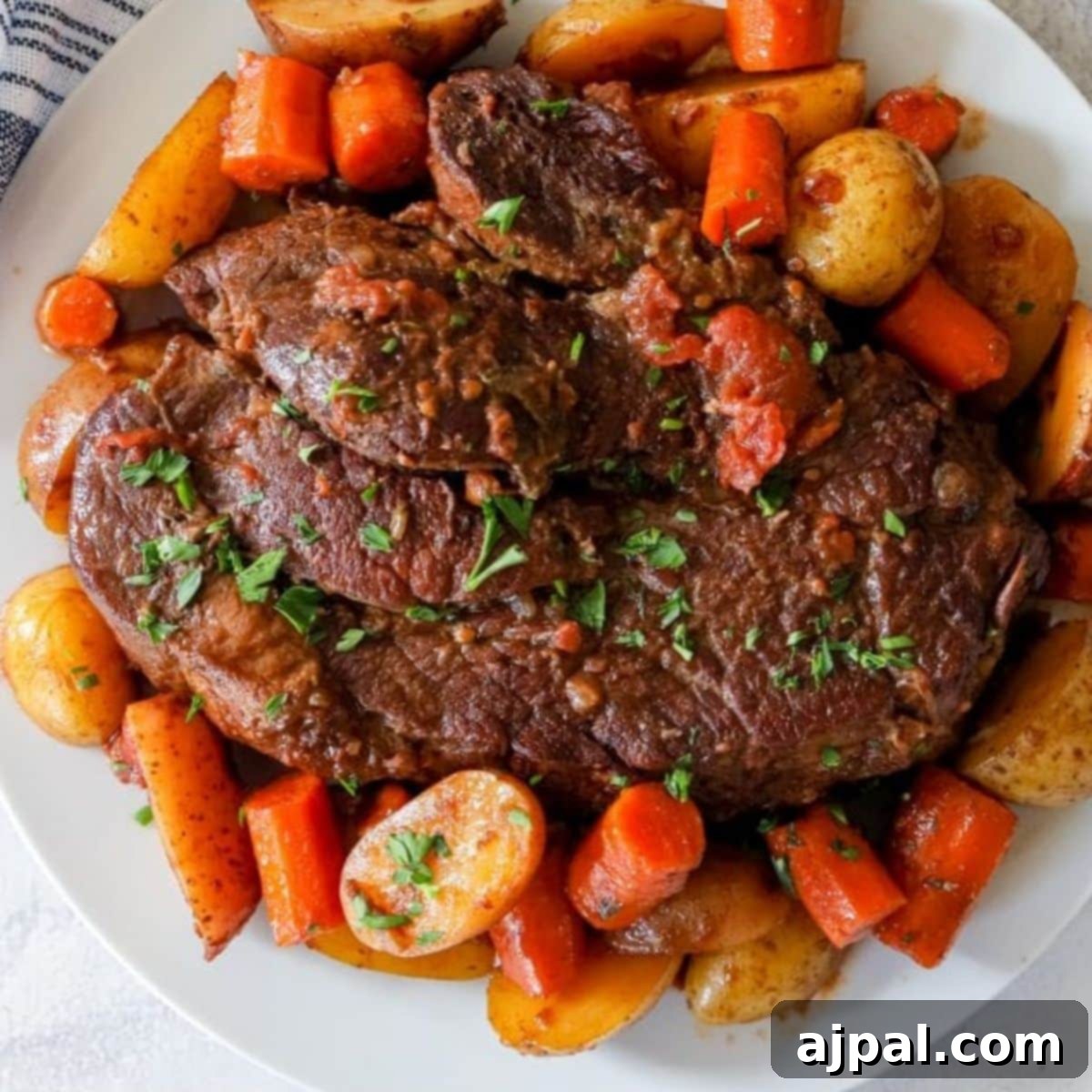 Effortless Pot Roast in Your Instant Pot 8 picture of pot roast and vegetables on a plate in front of an instant pot