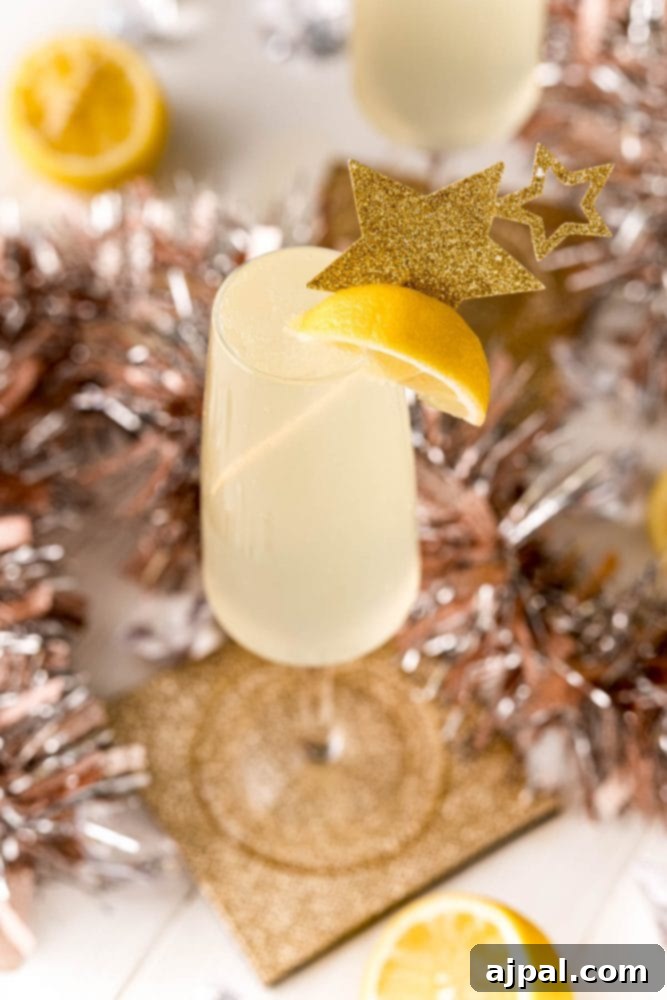 Effortless Champagne Fizz 2 fizzy lemon drink with a lemon slice in it