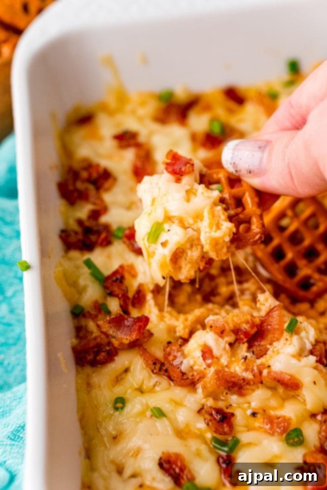 A person preparing an irresistible keto bacon cheese dip.