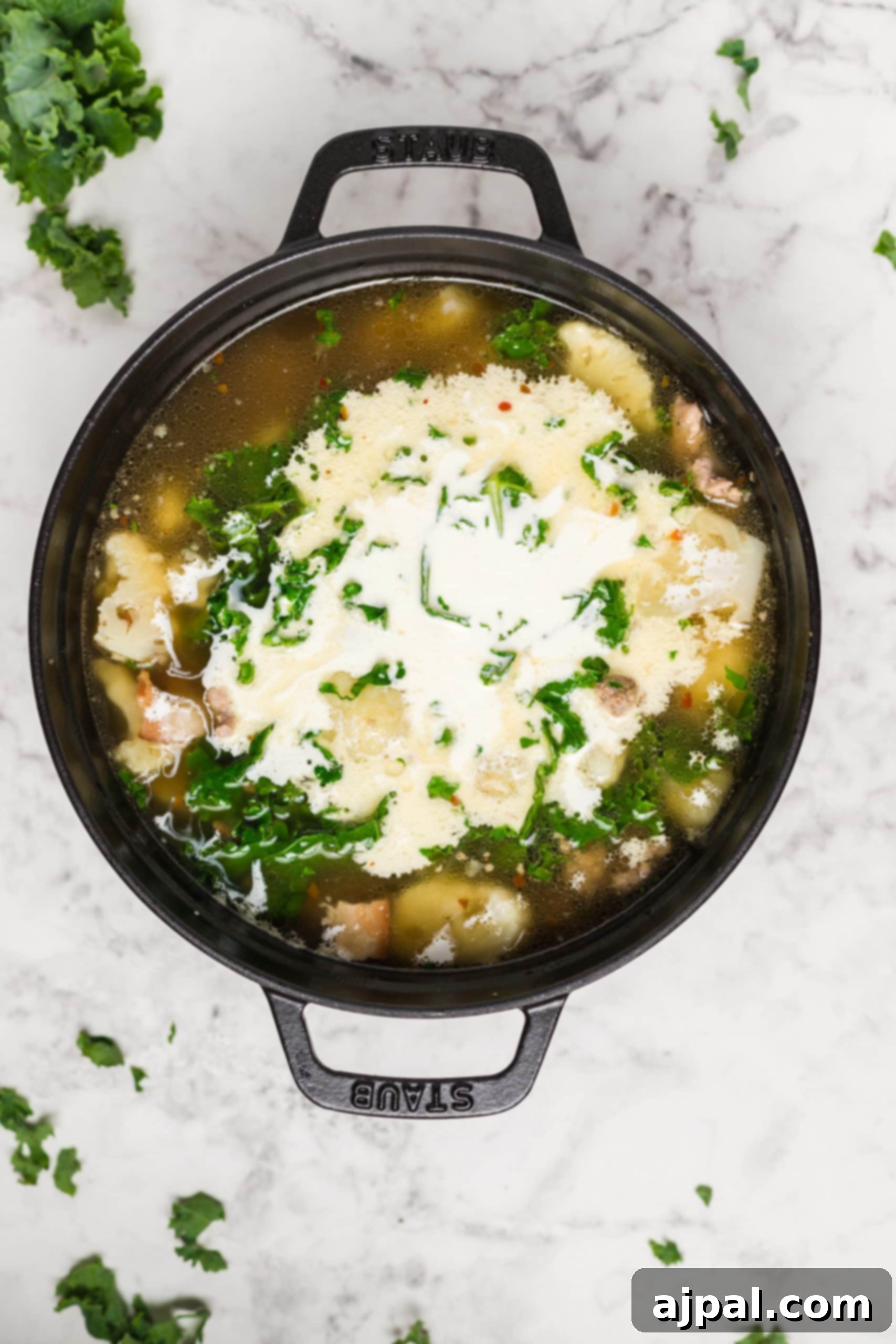 Simple Creamy Keto Tuscan Kale Soup 13 Easy Keto Tuscan Kale Soup Recipe, beautifully presented with a garnish of cheese and parsley.