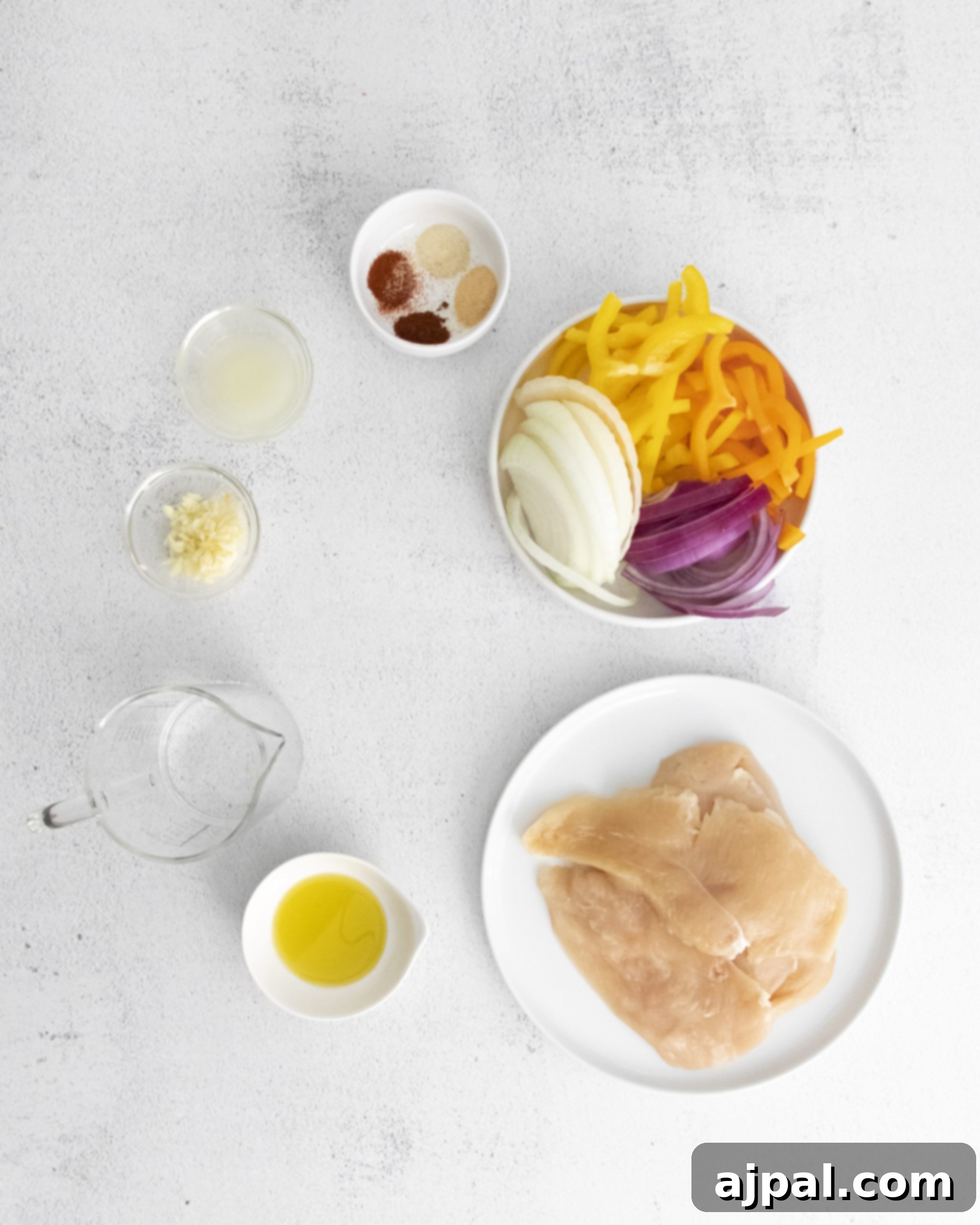 The vibrant ingredients for a keto chicken fajita dish, artfully arranged on a pristine white plate, promising a healthy and delicious meal.