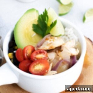 Instant Pot Chicken Fajita Bowls Recipe featuring chicken, avocado, tomatoes and limes.