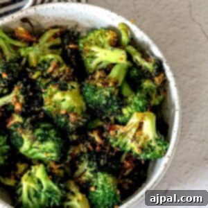 Roasted broccoli with a keto-friendly fork.