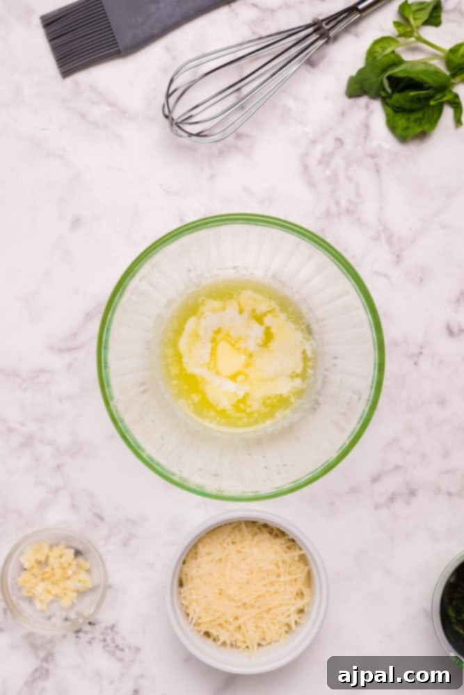Melted butter in a small white bowl, an essential ingredient for hollandaise sauce.