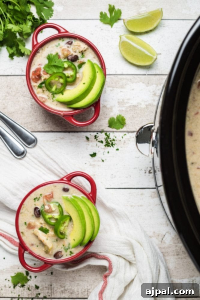 Easy Slow Cooker Chicken Enchilada Soup 3 Slow Cooker Chicken Enchilada Soup with avocados.
