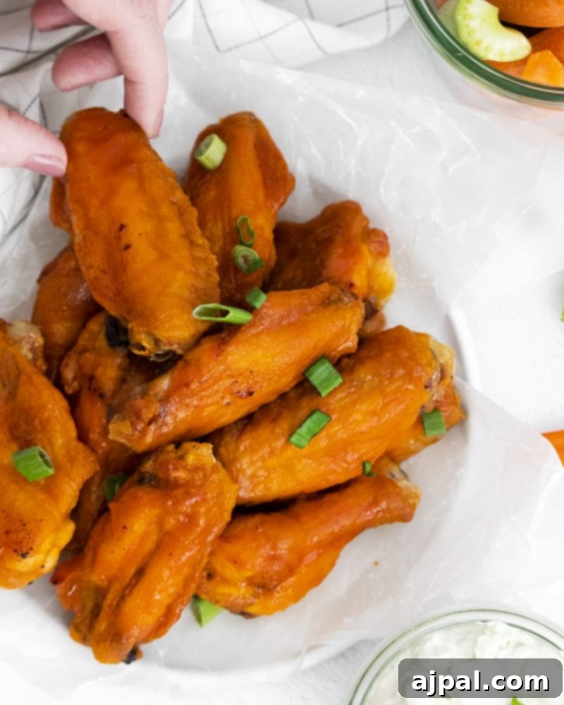 Sticky Sweet Buffalo Wings 3 A vibrant plate of honey buffalo wings, showcasing their glossy sauce and golden-brown crispiness.