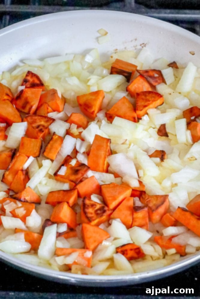 Comforting Sweet Potato, Kale & Black Bean Skillet 7 sweet potatoes diced and onions