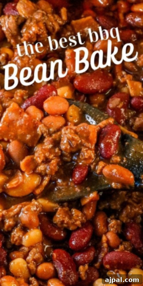 A delightful bowl of bacon and beef loaded BBQ baked beans, perfectly cooked and presented as an irresistible side dish.