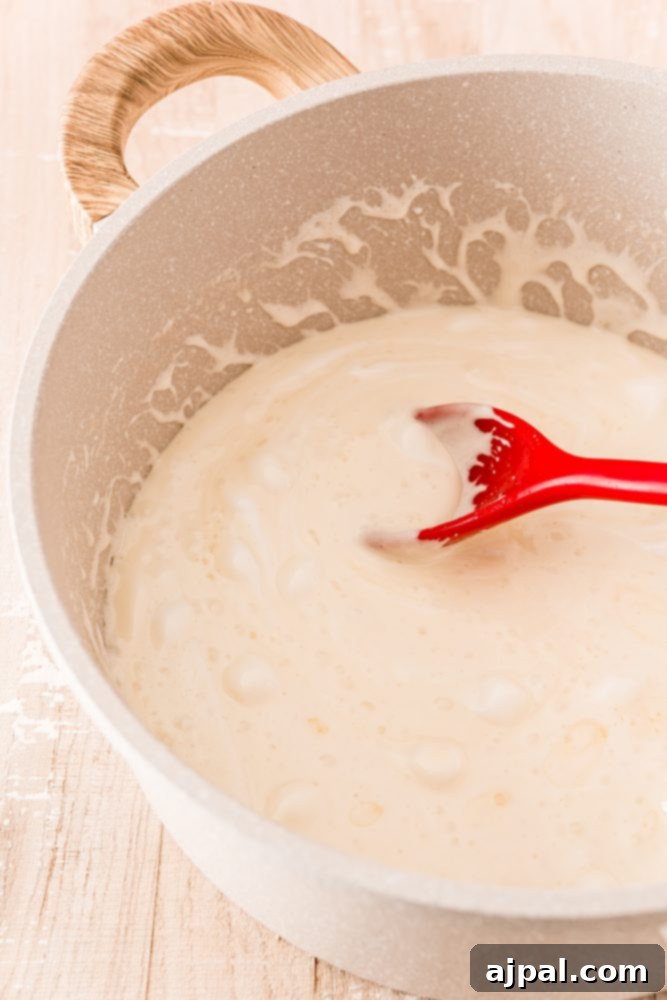 White Chocolate Raspberry Krispie Delights 10 Melted marshmallows in a bowl, smooth and ready to be combined with other ingredients.