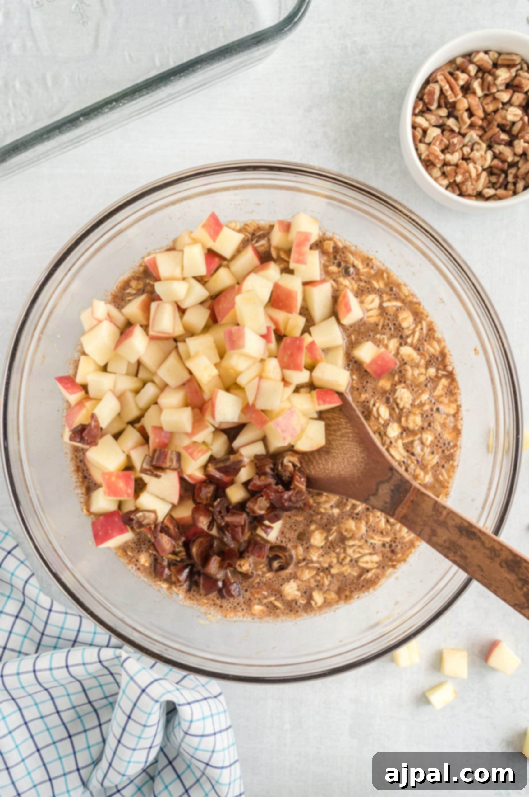 A warm, inviting baked apple oatmeal presented in a elegant glass bowl, ready to be served.