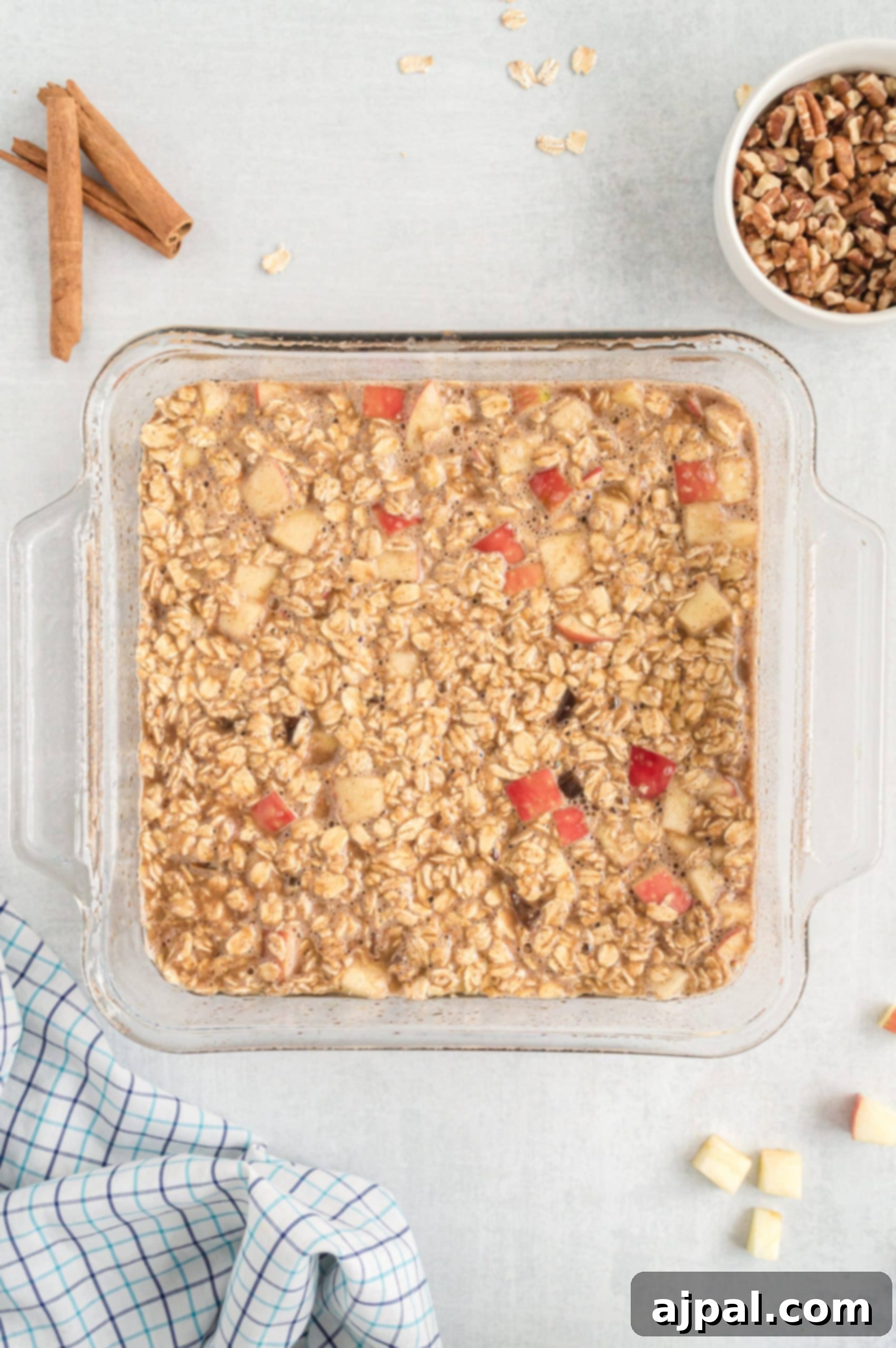 Homemade Easy Apple Cinnamon Granola, perfectly baked and presented in a clear glass dish.