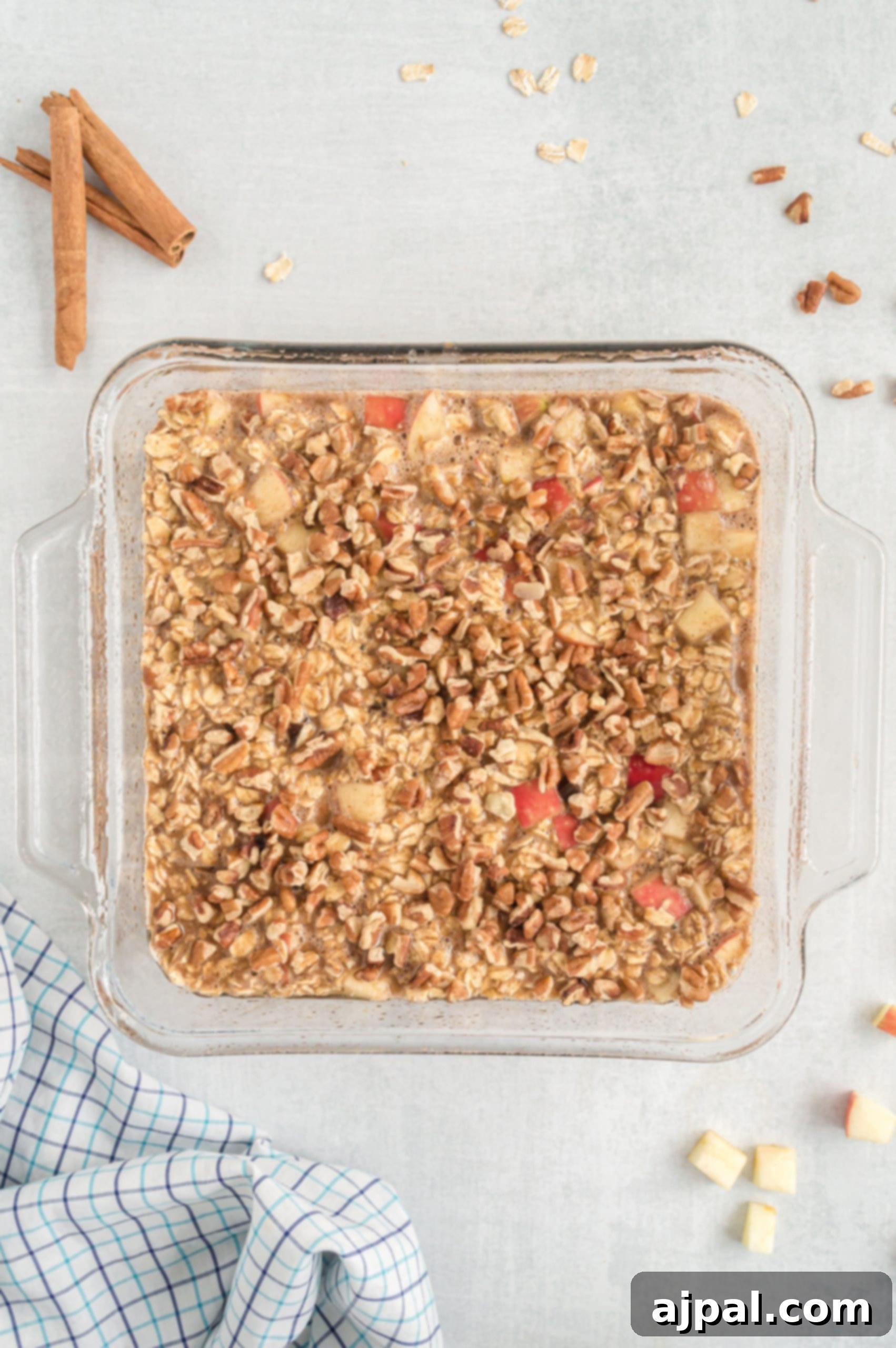 Irresistible apple cinnamon granola, beautifully presented in a clear glass dish, perfect for breakfast or a healthy snack.