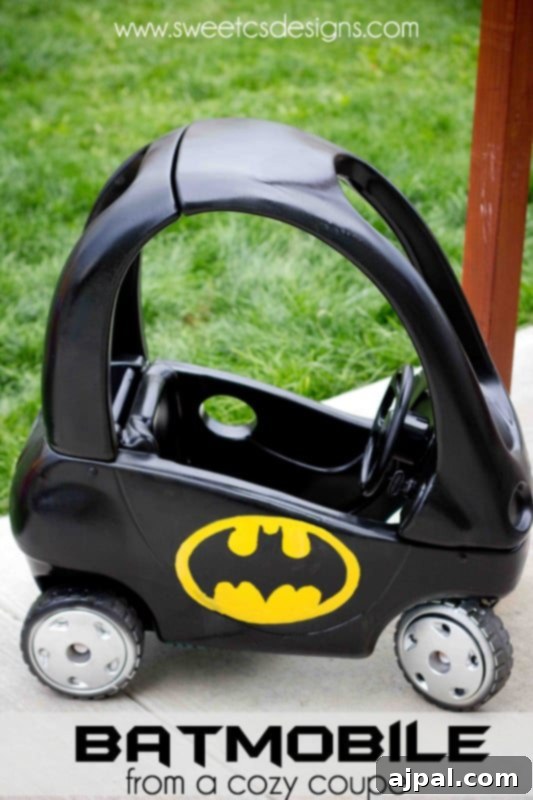 DIY Batmobile from a Cozy Coupe Picture of a Little Tikes Cozy Coupe painted to resemble a Batmobile, ready for a child's superhero adventures
