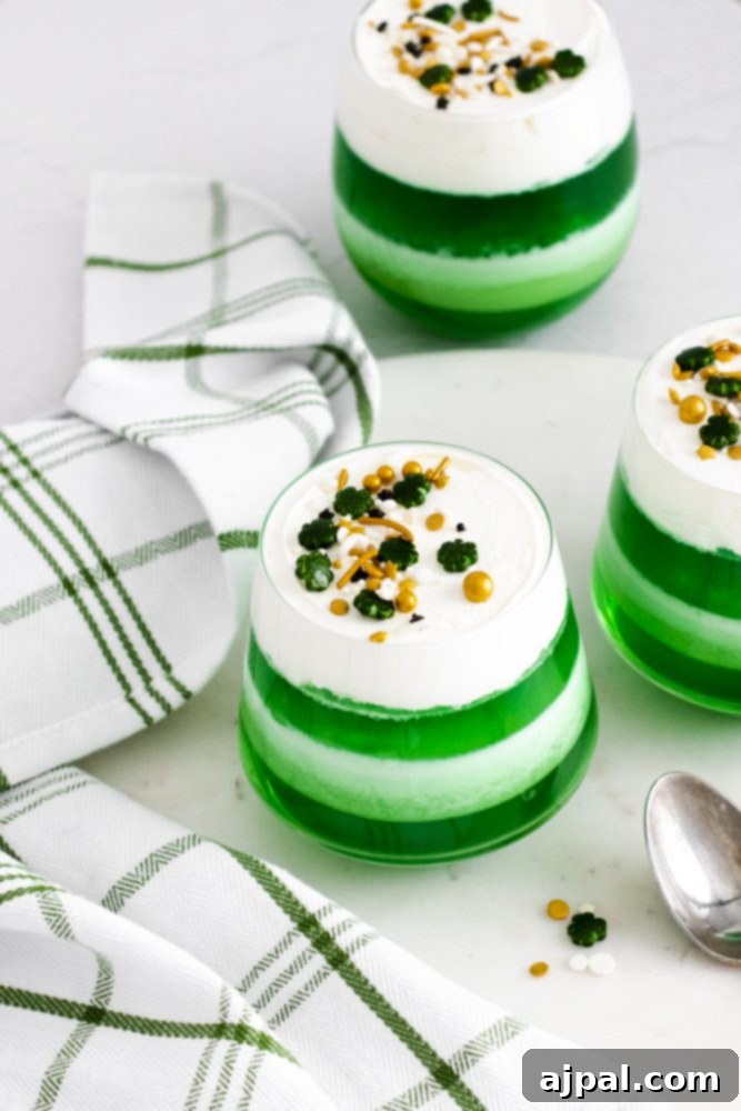 Easy St. Patrick’s Day jello shots with whipped cream.